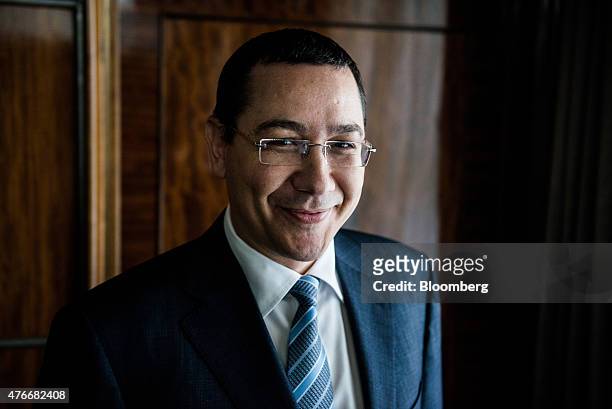 Victor Ponta, Romania's prime minister, poses for a photograph following an interview at the Victoria Palace in Bucharest, Romania, on Thursday, June...