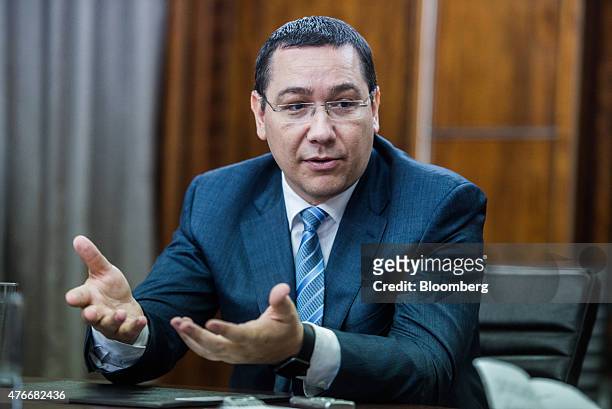 Victor Ponta, Romania's prime minister, gestures whilst speaking during an interview at the Victoria Palace in Bucharest, Romania, on Thursday, June...