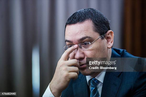 Victor Ponta, Romania's prime minister, pauses during an interview at the Victoria Palace in Bucharest, Romania, on Thursday, June 11, 2015. A...