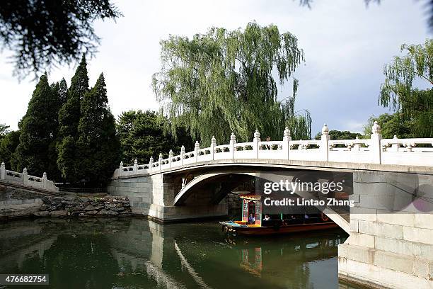 Tourists take a boat cruise at the Summer Palace on June 11, 2015 in Beijing, China. Located on the northwest outskirts of Beijing, the site of the...
