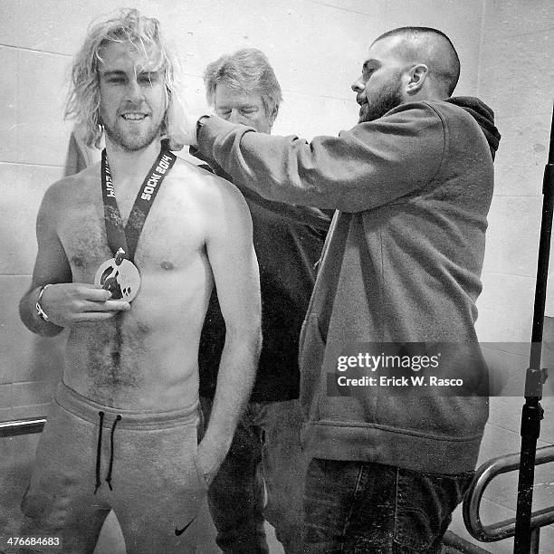 Winter Olympics: Closeup portrait of USA Sage Kotsenburg, gold medal winner of Men's Snowboard Slopestyle, casual with medal while shirtless during...