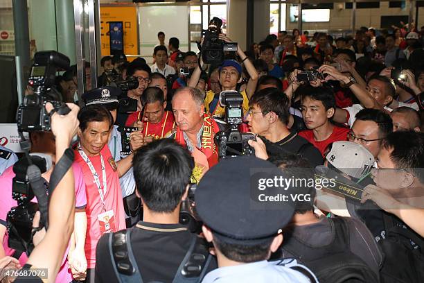 Football fans welcome Luiz Felipe Scolari, new coach of Guangzhou Evergrande, on his arrival at Baiyun International Airport on June 11, 2015 in...