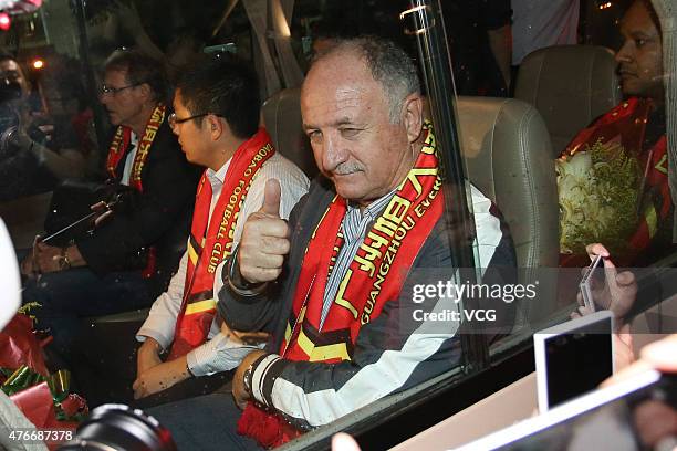 Football fans welcome Luiz Felipe Scolari, new coach of Guangzhou Evergrande, on his arrival at Baiyun International Airport on June 11, 2015 in...