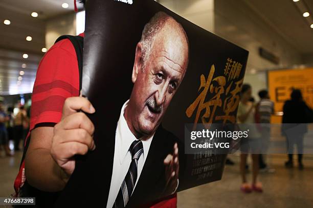 Football fans welcome Luiz Felipe Scolari, new coach of Guangzhou Evergrande, on his arrival at Baiyun International Airport on June 11, 2015 in...