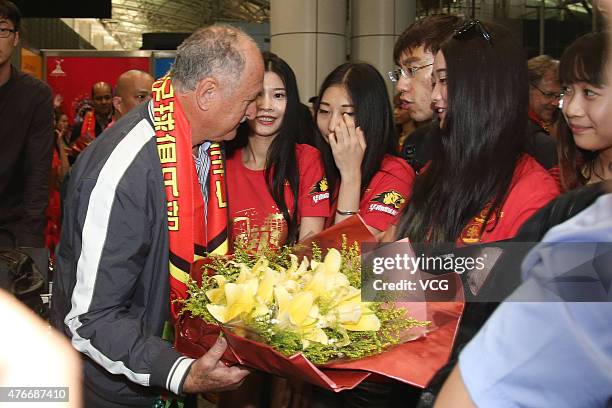 Football fans welcome Luiz Felipe Scolari, new coach of Guangzhou Evergrande, on his arrival at Baiyun International Airport on June 11, 2015 in...