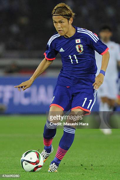 Takashi Uwami of Japan in action during the international friendly match between Japan and Iraq at Nissan Stadium on June 11, 2015 in Yokohama, Japan.