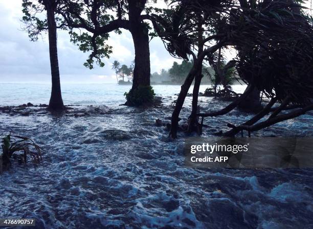 High tide energized by storm surges washes across Ejit Island in Majuro Atoll, Marshall Islands on March 3 causing widespread flooding and damaging a...