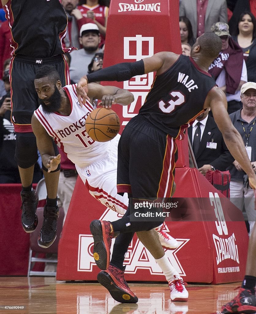 Heat Rockets Fight James Harden of the Houston Rockets is fouled by Dwyane Wade of the ...