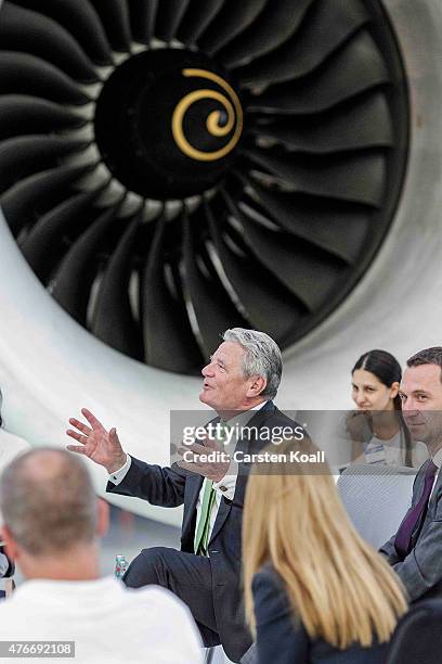 German President Joachim Gauck talks with employees while visiting the Rolls-Royce Mechanical Testing Operations Center on June 11, 2015 near Berlin,...