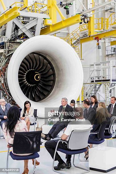 German President Joachim Gauck talks with employees while visiting the Rolls-Royce Mechanical Testing Operations Center on June 11, 2015 near Berlin,...