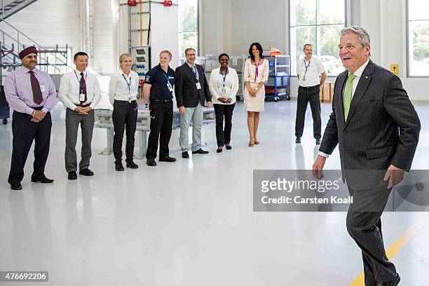 German President Joachim Gauck passing employees while visiting the Rolls-Royce Mechanical Testing Operations Center on June 11, 2015 near Berlin,...