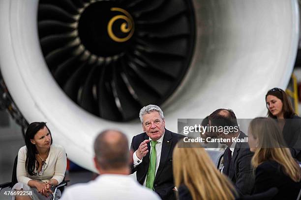 German President Joachim Gauck talks with employees while visiting the Rolls-Royce Mechanical Testing Operations Center on June 11, 2015 near Berlin,...