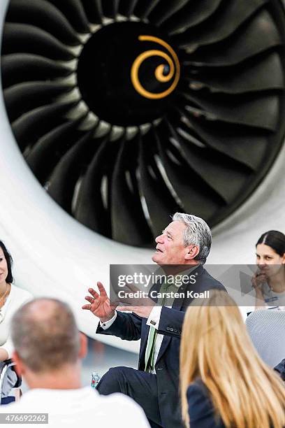 German President Joachim Gauck talks with employees while visiting the Rolls-Royce Mechanical Testing Operations Center on June 11, 2015 near Berlin,...