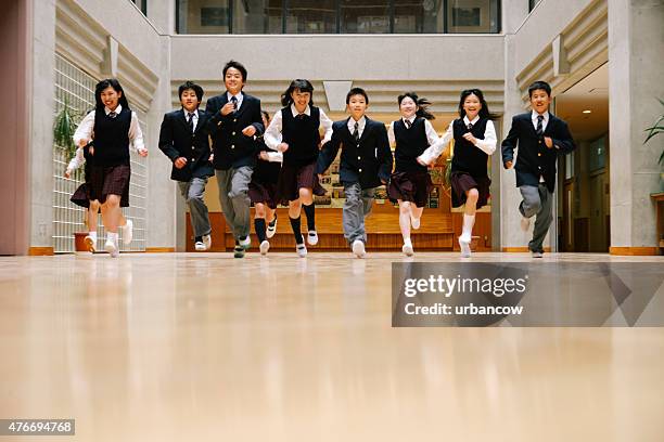 japanese high school children, ten teenage children run, school hall - samlingssal bildbanksfoton och bilder