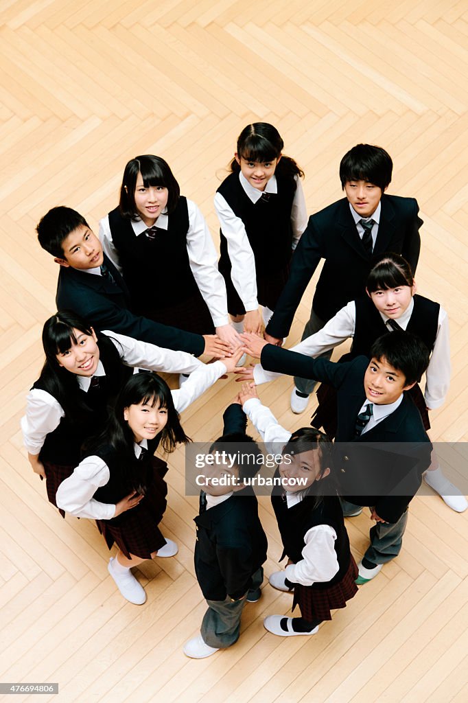 Japanese high school children, ten teenage children, circle of hands