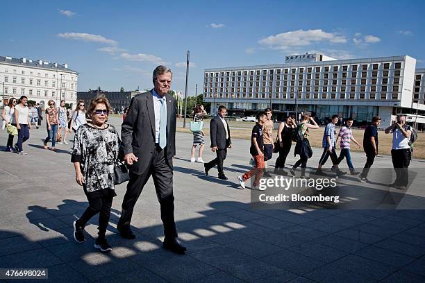 Jeb Bush, former governor of Florida, walks with his wife Columba Bush in Pilsudski Square in Warsaw, Poland, on Thursday, June 11, 2015. Bush is on...