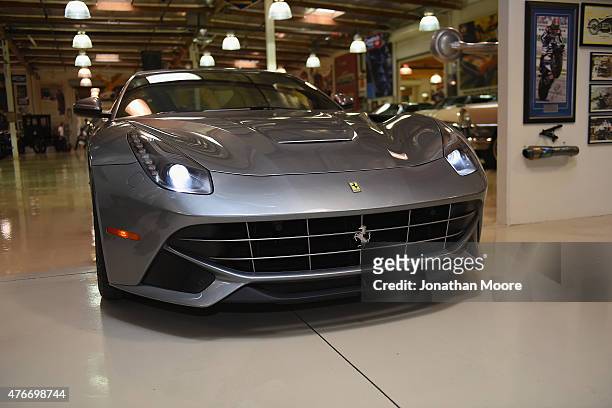 Racing legend Mario Andretti arrives to the final stop of the Shell Cross-Country Relay at Jay Lenos Garage in a Ferrari California T on June 9 to...