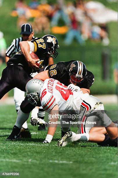 Andy Katzenmoyer of the Ohio State Buckeyes makes a tackle against the Missouri Tigers on September 27, 1997.