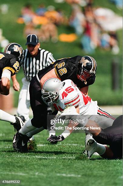 Andy Katzenmoyer of the Ohio State Buckeyes makes a tackle against the Missouri Tigers on September 27, 1997.