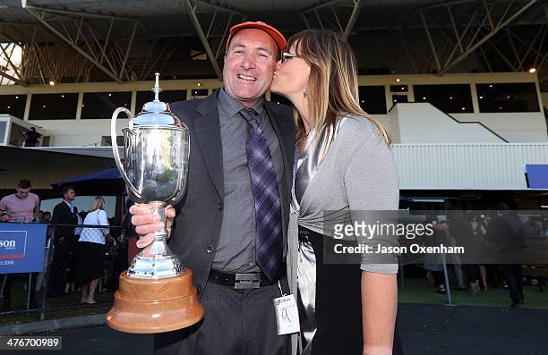 Mike O'Leary, part owner of the winning horse" Who Shot Thebarman" gets a kiss from his wife Lynette O'Leary after winning race 9 The 2014 Auckland...