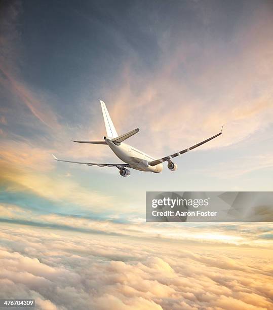 airplane in flight - sunset stock illustrations