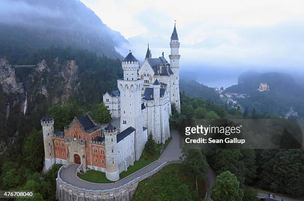 Schloss Neuschwanstein castle , as well as Schloss Hohenschwangau , stand in this aerial view in the early morning on June 11, 2015 near...