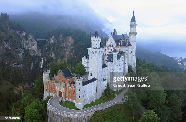 Schloss Neuschwanstein castle stands in this aerial view in the early morning on June 11, 2015 near Hohenschwangau, Germany. Schloss Neuschwanstein,...