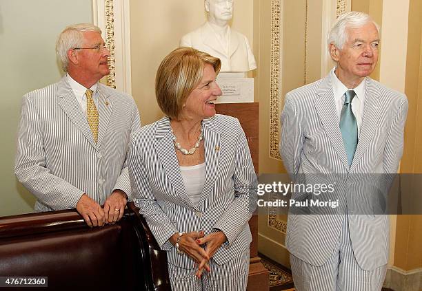 Senators Roger Wicker , Sen. Shelley Capito , and Sen. Thad Cochran , gather before a group photo to celebrate National Seersucker Day at the U.S....