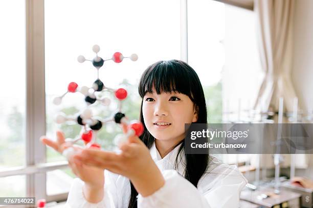 japanese high school. students study, science laboratory, holding molecular model - chemistry model stock pictures, royalty-free photos & images