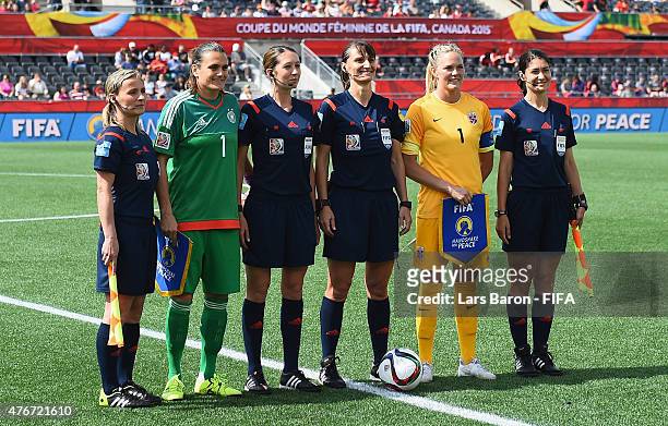 Nadine Angerer of Germany and Ingred Hjelmseth of Norway pose for a picture prior to the FIFA Women's World Cup 2015 Group B match between Germany...