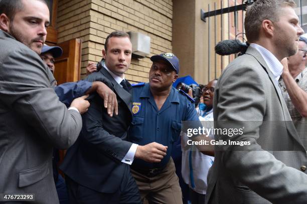 The accused is escorted outside the Pretoria High Court on March 5 in Pretoria, South Africa. Oscar Pistorius stands accused of the murder of his...