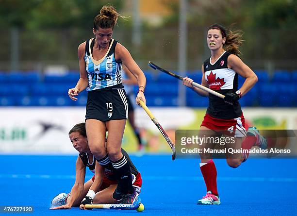 Agustina Albertario of Argentina is tackled by Karli Johansen of Canada during the match between Argentina and Canada at Polideportivo Virgen del...
