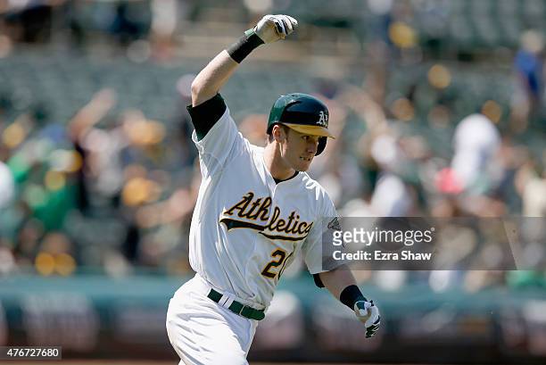 Mark Canha of the Oakland Athletics reacts as he runs up the first base line after hitting a two-run home run in the eighth inning of their game...