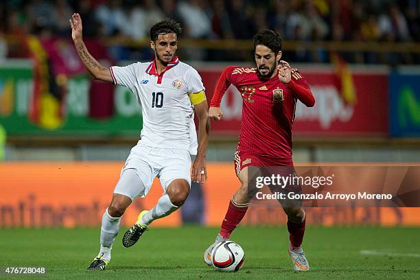 Francisco Alarcon alias Isco of Spain competes for the ball with Bryan Ruiz of Costa Rica during the international friendly match between Spain and...