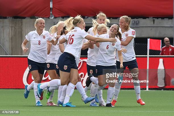 Maren Mjelde of Norway celebrates her goal on a direct kick with team mates during the FIFA Women's World Cup Canada 2015 Group B match between...