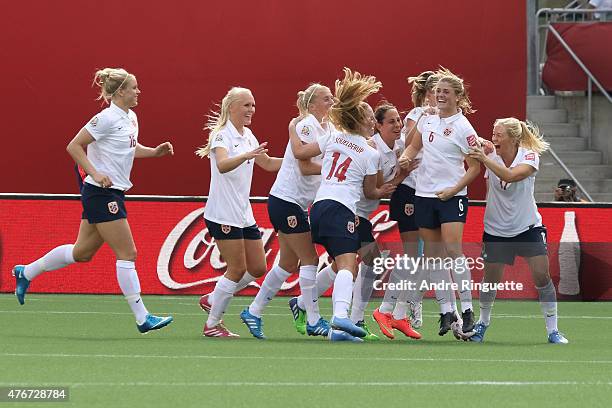 Maren Mjelde of Norway celebrates her goal on a direct kick with team mates during the FIFA Women's World Cup Canada 2015 Group B match between...