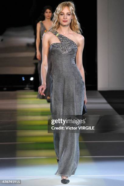 Model walks the runway during the Giorgio Armani as a part of Milan Fashion Week Womenswear Autumn/Winter 2014 on February 24, 2014 in Milan, Italy.