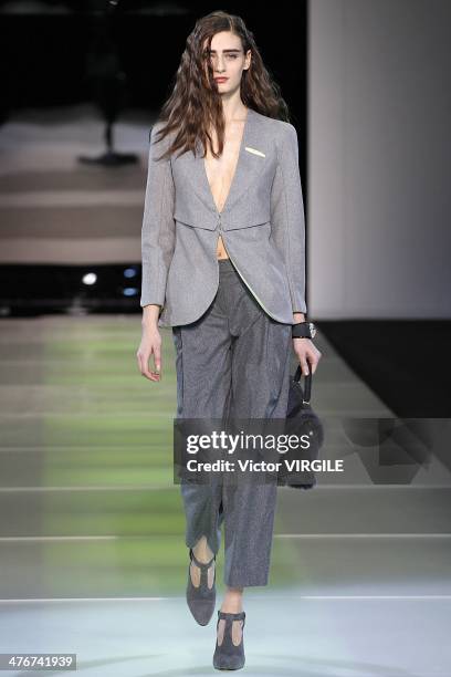 Model walks the runway during the Giorgio Armani as a part of Milan Fashion Week Womenswear Autumn/Winter 2014 on February 24, 2014 in Milan, Italy.