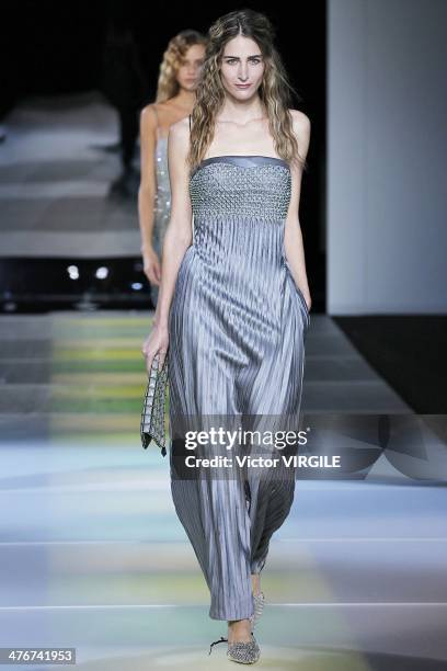 Model walks the runway during the Giorgio Armani as a part of Milan Fashion Week Womenswear Autumn/Winter 2014 on February 24, 2014 in Milan, Italy.