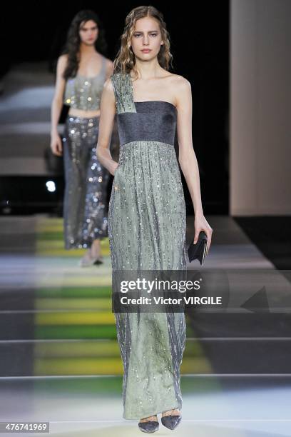 Model walks the runway during the Giorgio Armani as a part of Milan Fashion Week Womenswear Autumn/Winter 2014 on February 24, 2014 in Milan, Italy.