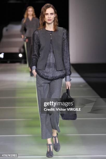 Model walks the runway during the Giorgio Armani as a part of Milan Fashion Week Womenswear Autumn/Winter 2014 on February 24, 2014 in Milan, Italy.