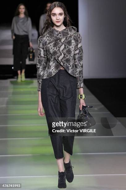 Model walks the runway during the Giorgio Armani as a part of Milan Fashion Week Womenswear Autumn/Winter 2014 on February 24, 2014 in Milan, Italy.