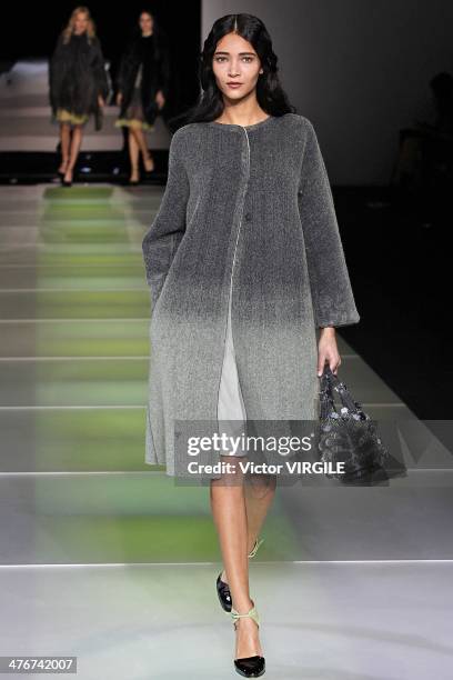 Model walks the runway during the Giorgio Armani as a part of Milan Fashion Week Womenswear Autumn/Winter 2014 on February 24, 2014 in Milan, Italy.