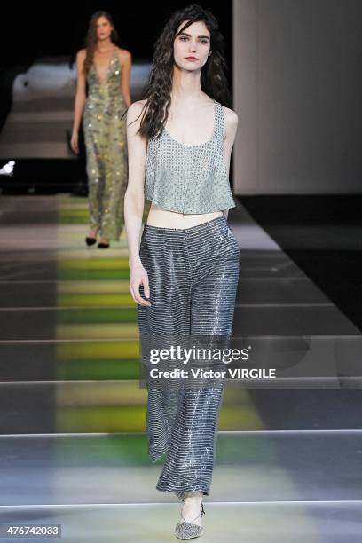 Model walks the runway during the Giorgio Armani as a part of Milan Fashion Week Womenswear Autumn/Winter 2014 on February 24, 2014 in Milan, Italy.