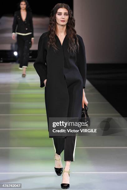 Model walks the runway during the Giorgio Armani as a part of Milan Fashion Week Womenswear Autumn/Winter 2014 on February 24, 2014 in Milan, Italy.