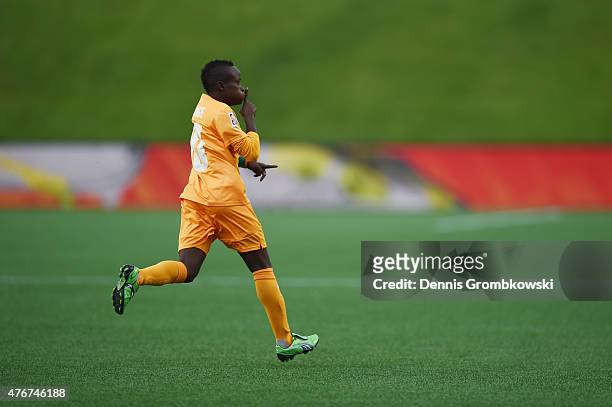 Ange Nguessan of Cote D'Ivoire celebrates as she scores the opening goal during the FIFA Women's World Cup Canada 2015 Group B match between Cote...