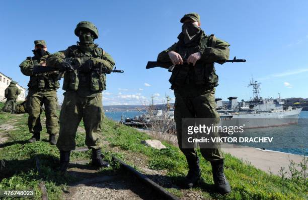 Russian forces patrol near the Ukrainian navy ship Slavutich in the harbor of the Ukrainian city of Sevastopol on March 5, 2014. Russian forces...