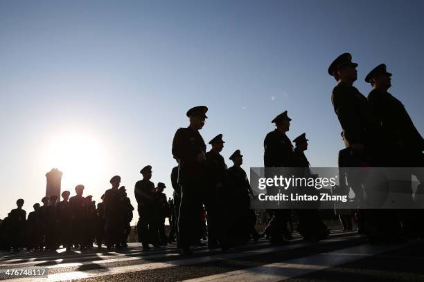 Delegates from Chinese People's Liberation Army march walks from Tiananmen Square to the Great Hall of the People to attend the opening ceremony of...