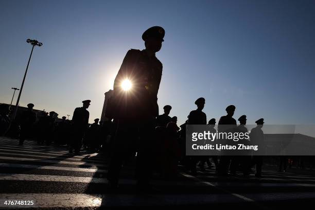 Delegates from Chinese People's Liberation Army march walks from Tiananmen Square to the Great Hall of the People to attend the opening ceremony of...