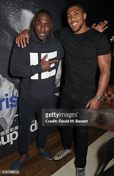 Idris Elba and Anthony Joshua attend the official Idris Elba + Superdry presentation at LCM at Hix on June 11, 2015 in London, England.